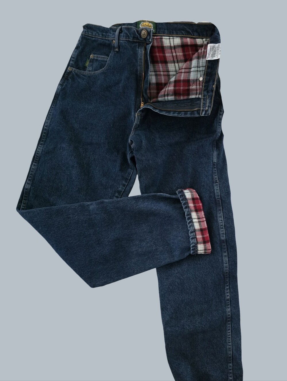 Cabellas Men's Dark Blue Jeans with Red Plaid Lining. Size 33x36